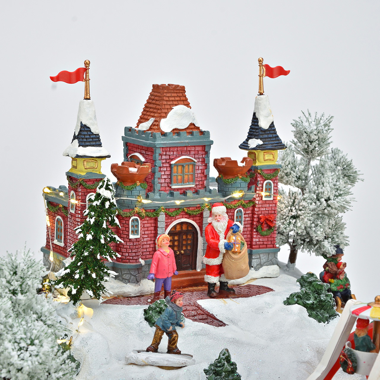Weihnachtsdorf, Karussell, Modelleisenbahn, Schneelandschaft, beleuchtete Dekoration