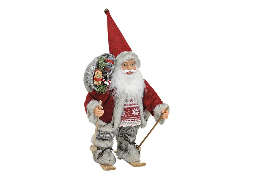 Babbo Natale sugli sci in rosso in plastica/tessuto/legno (L/H/D) 18x30x12 cm