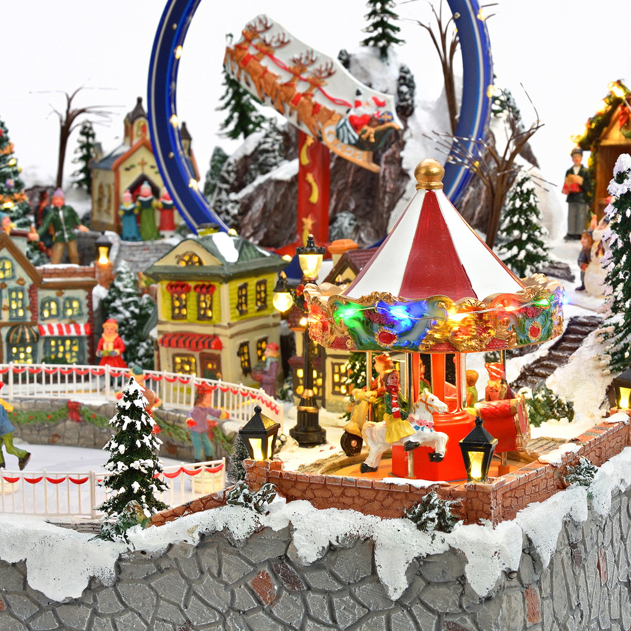 Weihnachtsdorf mit Eisenbahn und Schlittschuhbahn aus Poly Weihnachtsdorf, Winterlandschaft, Modelleisenbahn, Eislaufbahn, Karussell