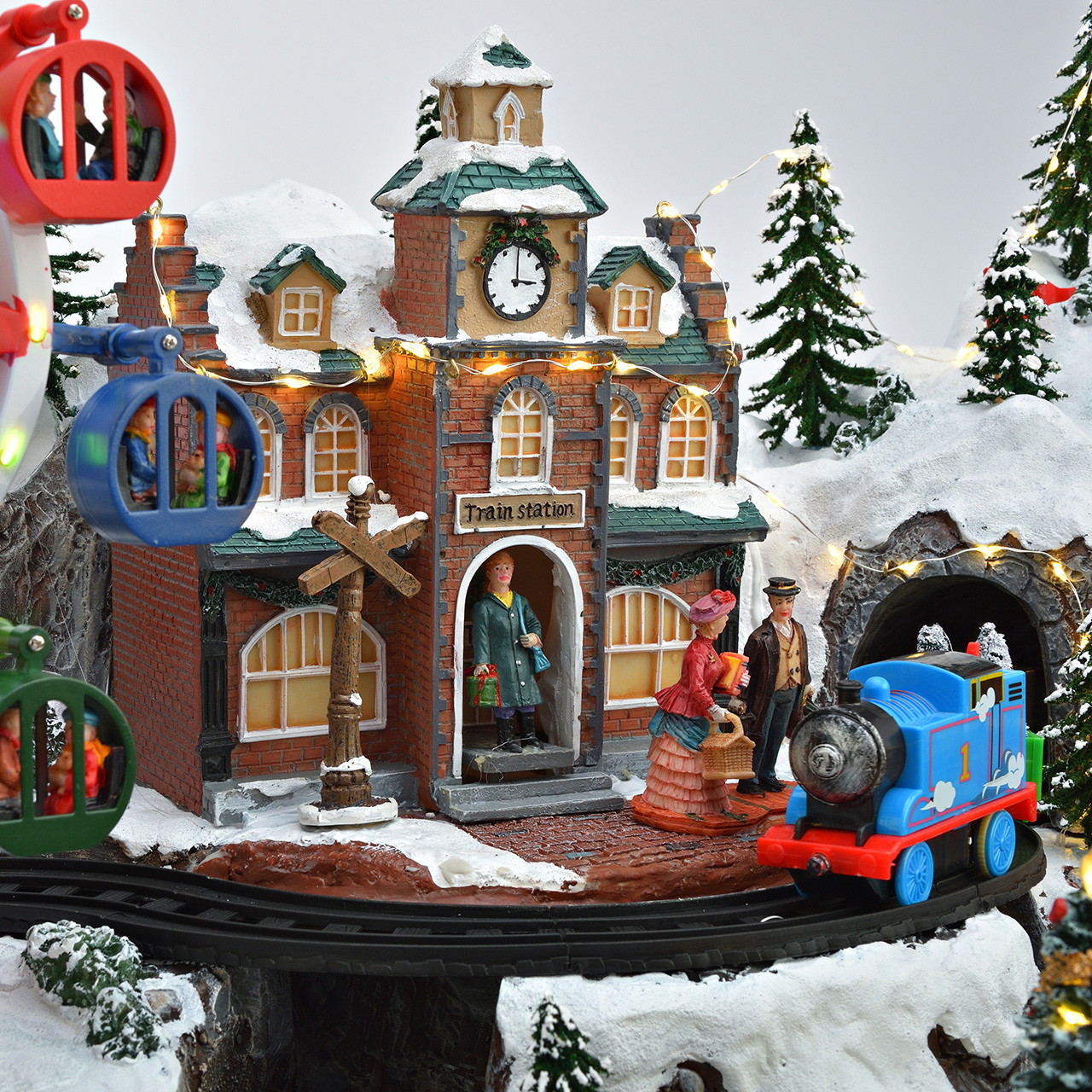 Weihnachtsdorf mit Riesenrad und Eisenbahn aus Poly Weihnachtsdorf, Modelleisenbahn, Riesenrad, Karussell, verschneite Landschaft